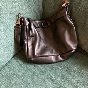 Rough & Tumble, small subway, measures 12w by 10h, plonge black, satchel carry.